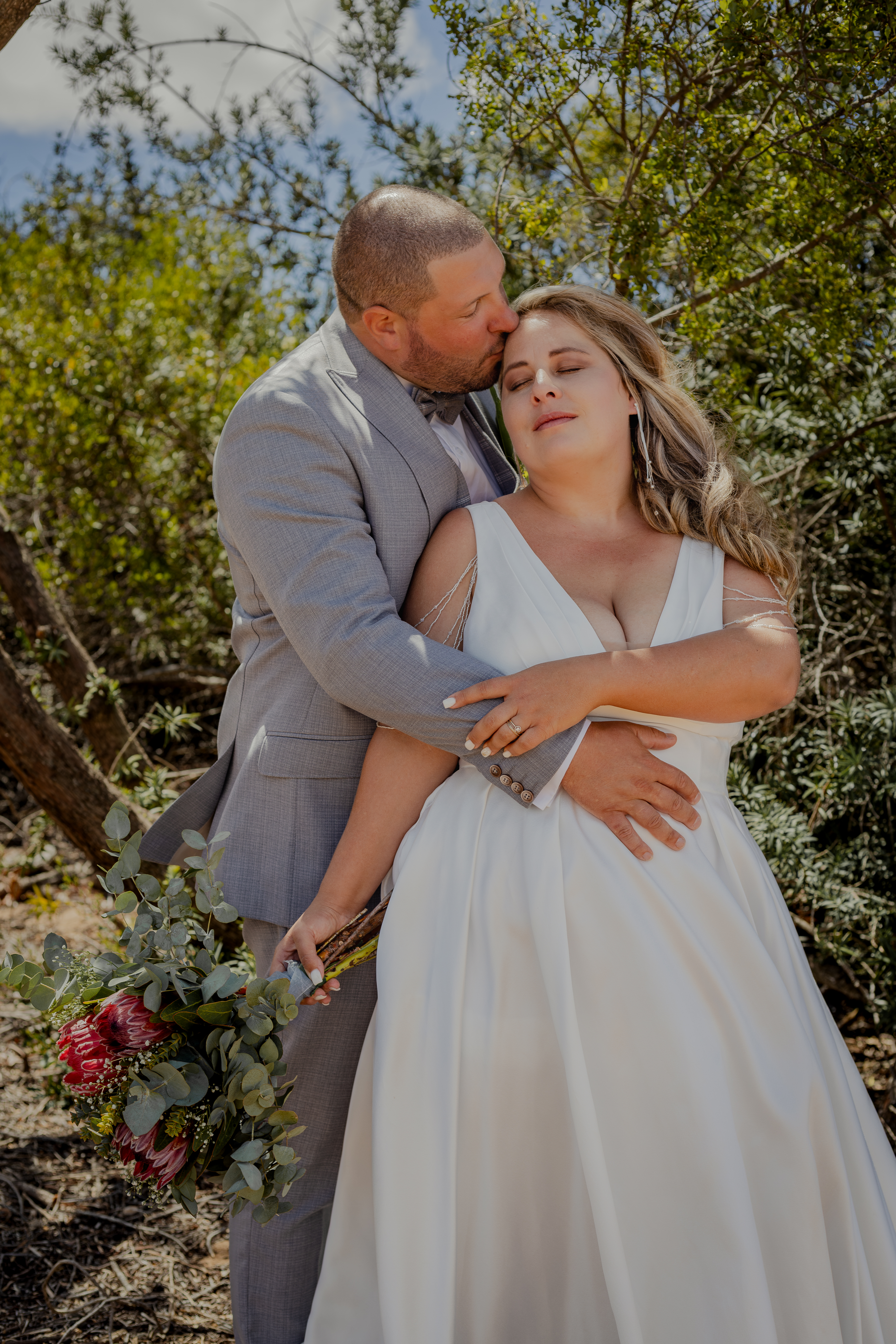 Bride and groom portrait in the trees