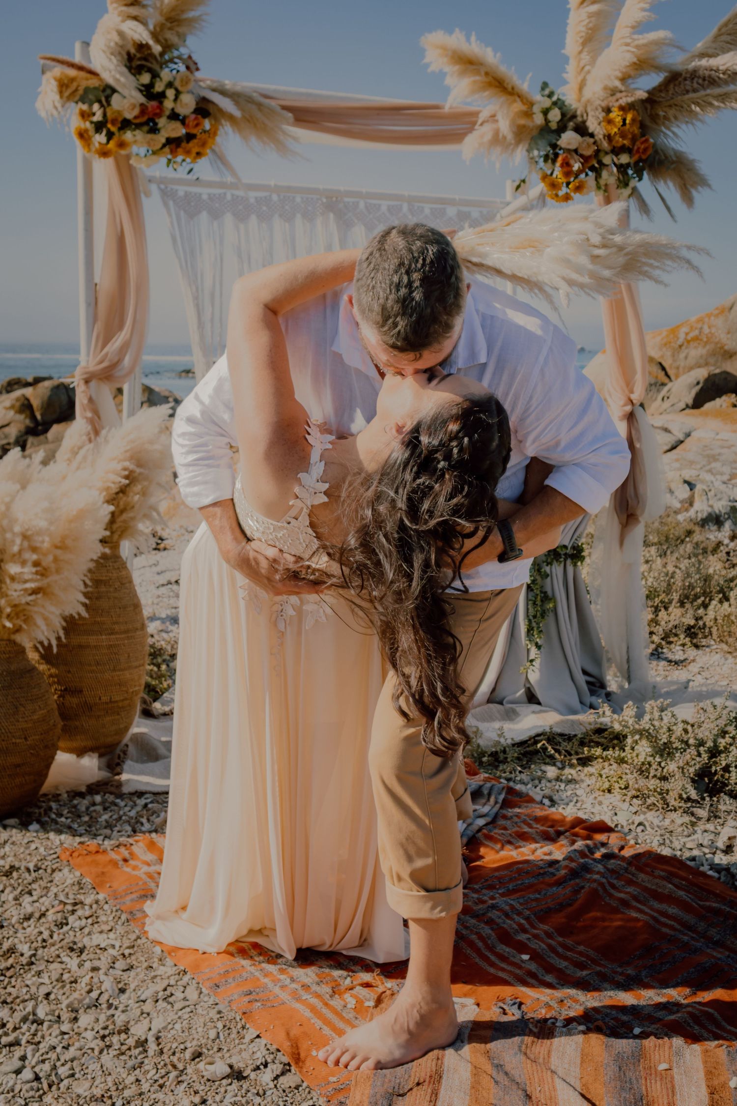 Beach ceremony kiss