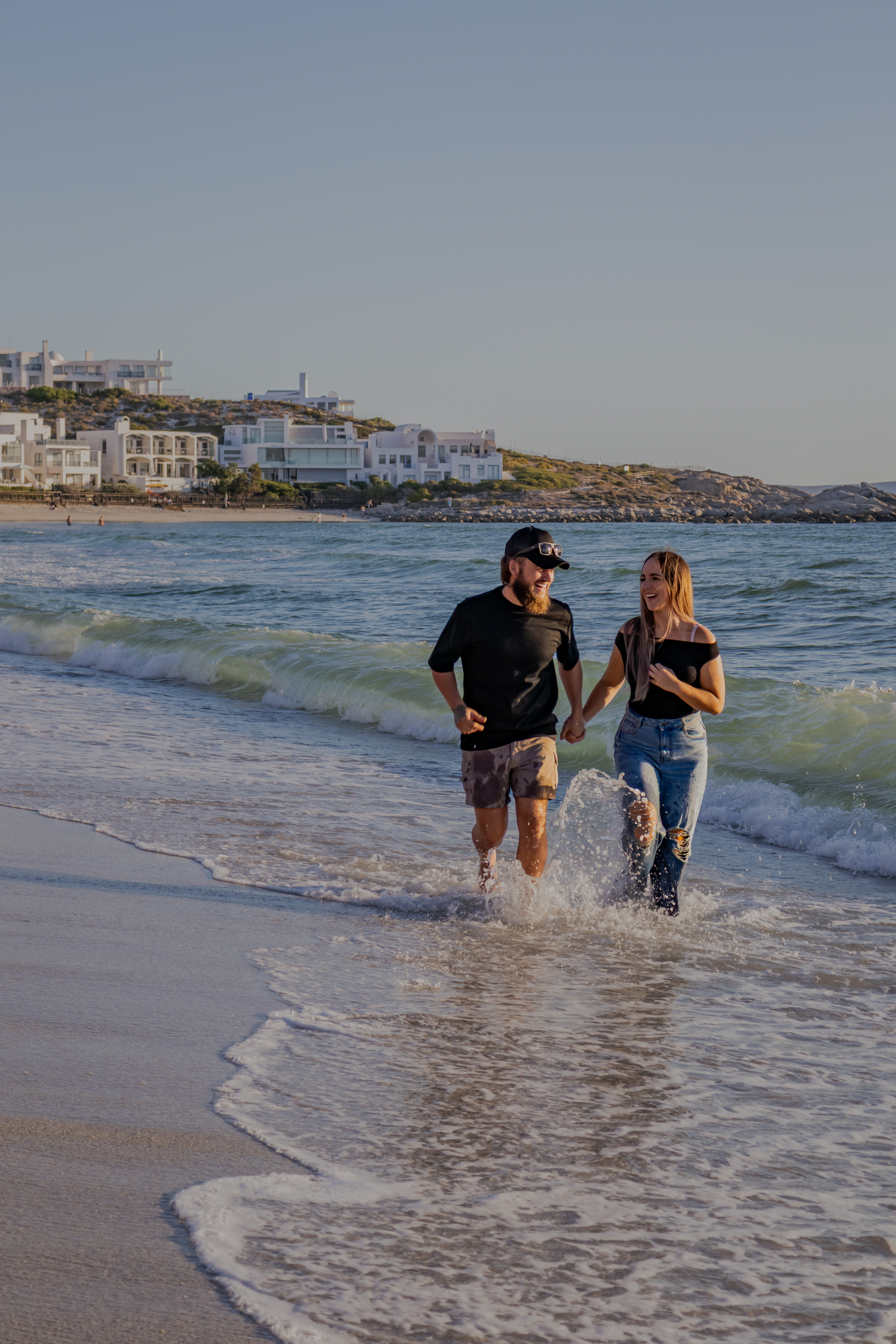 Couple walking through shallow water