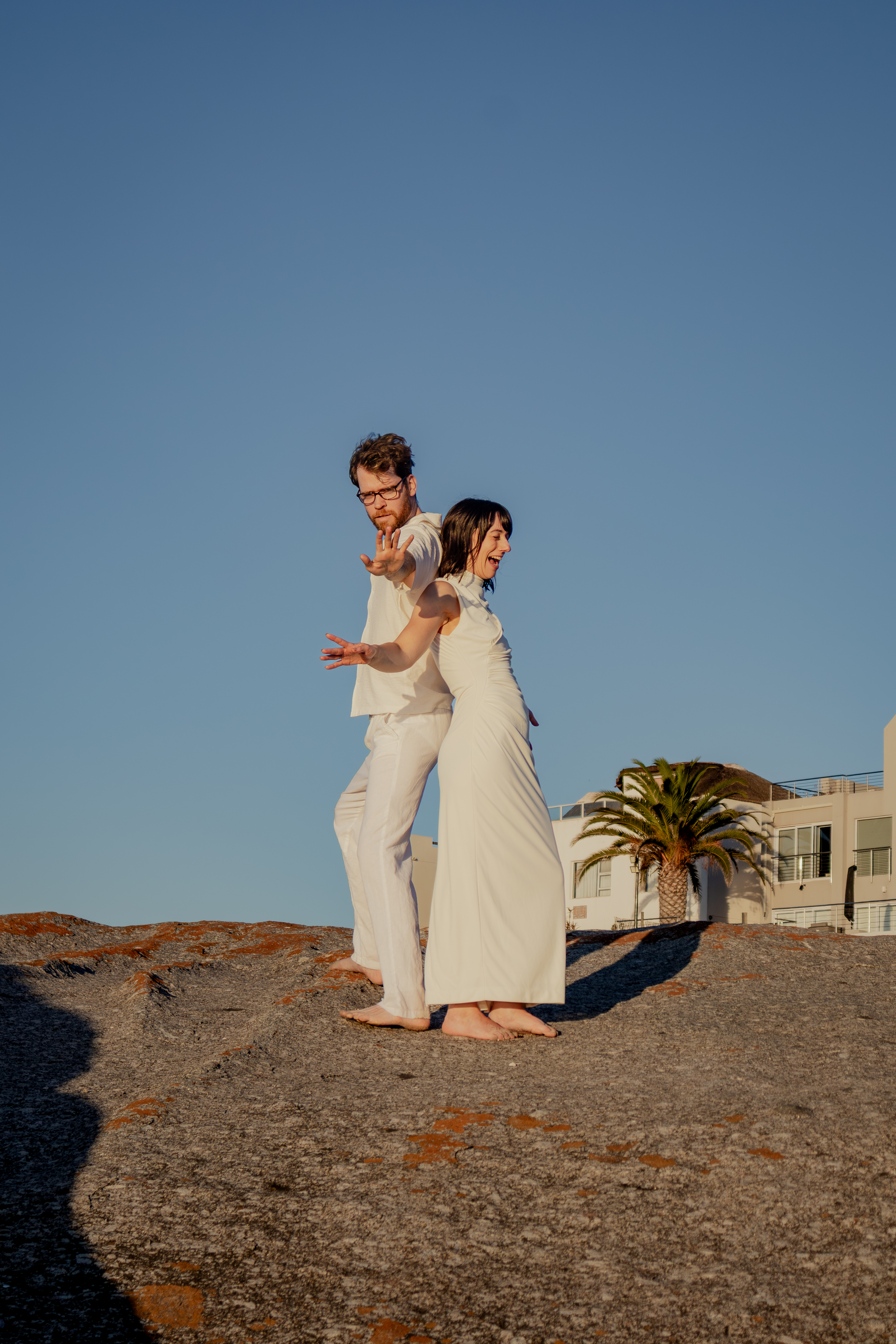 Couple laughing together by the sea
