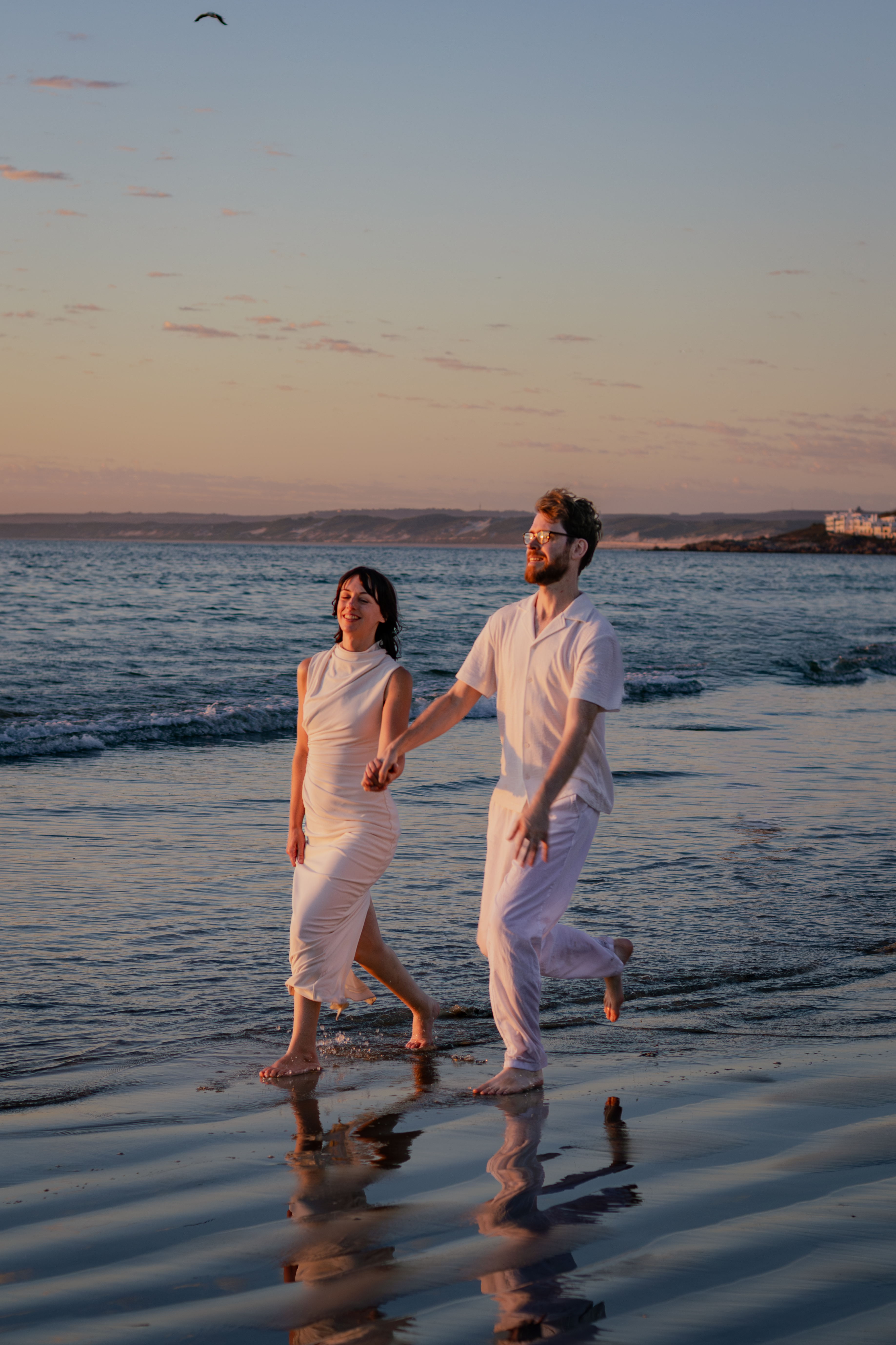 Couple smiling together in the surf