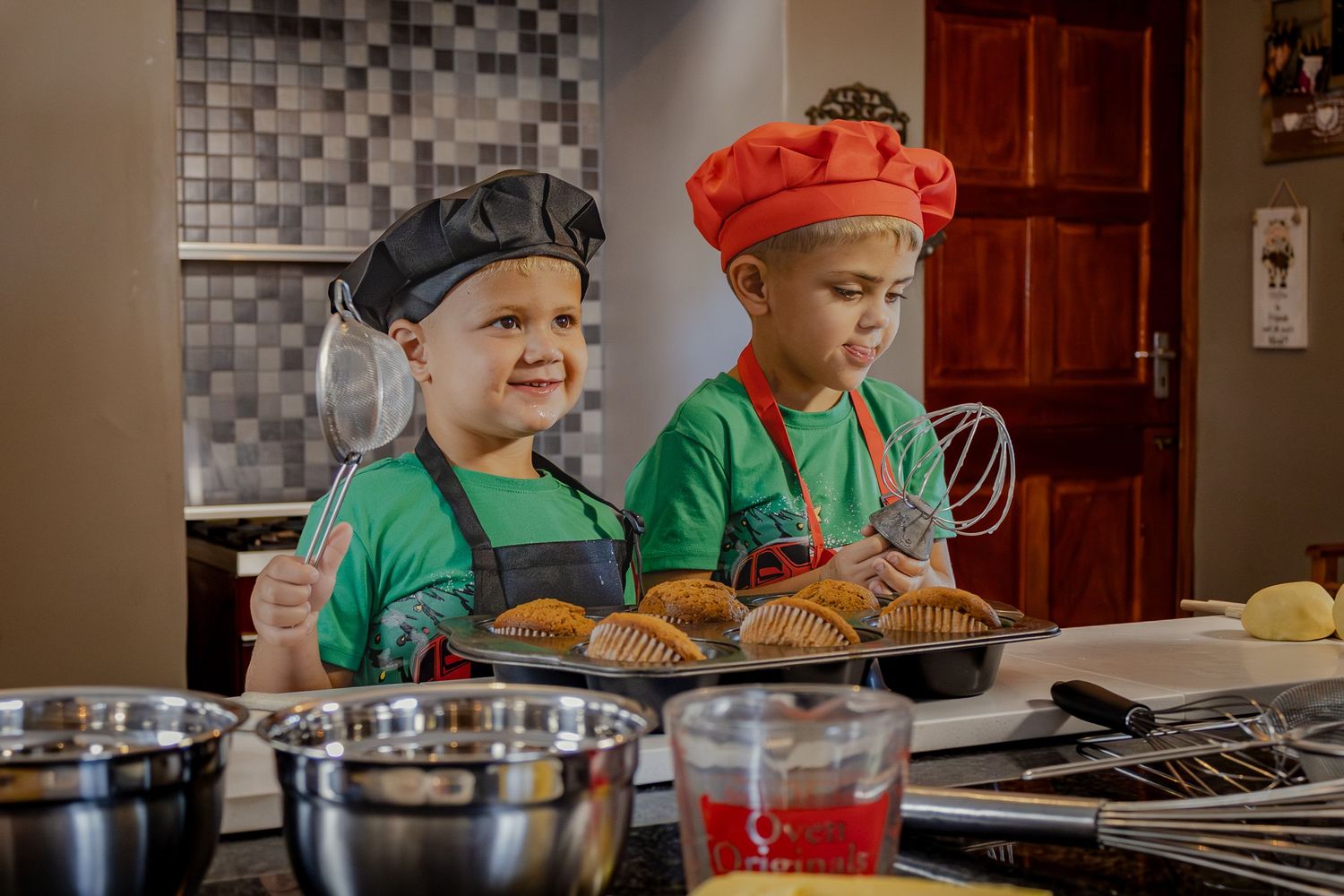 Children smiling together over their baking