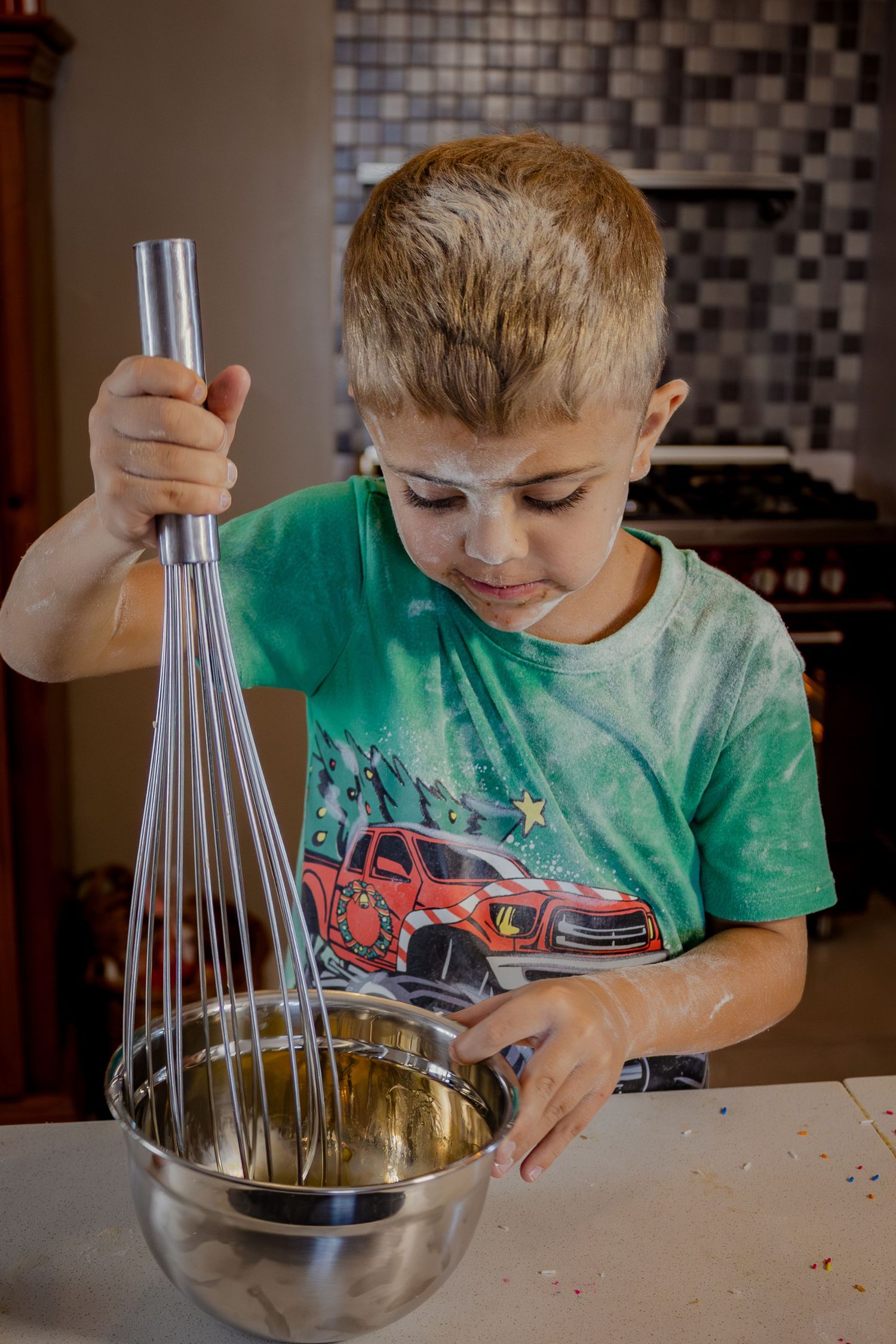 Children baking together in matching chef hats