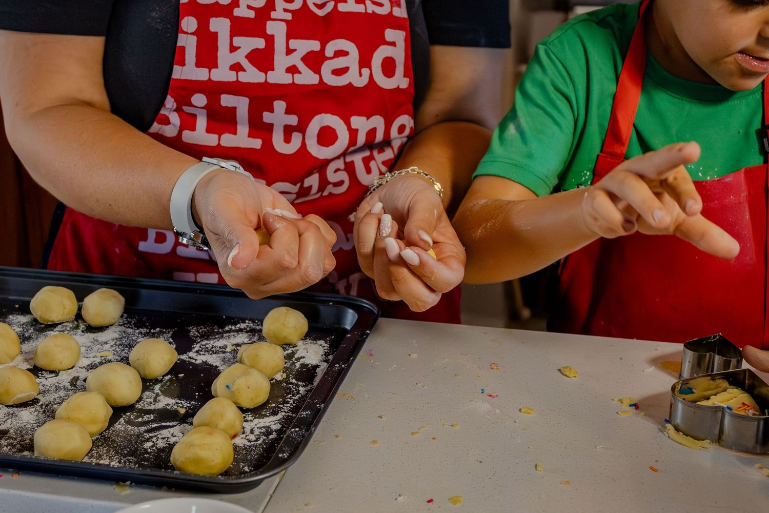Close-up of baking hands shaping dough